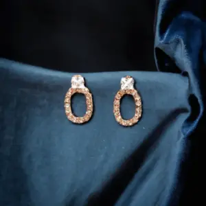 Classic diamond-studded oval hoop earring